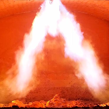 Oxy-fuel burner flames in non-ferrous metals production furnace